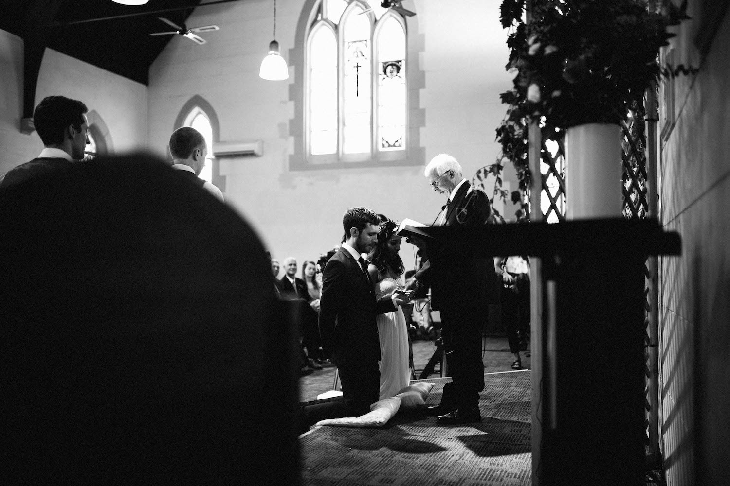 A bride & groom receiving an anglican blessing at their Subiaco wedding.