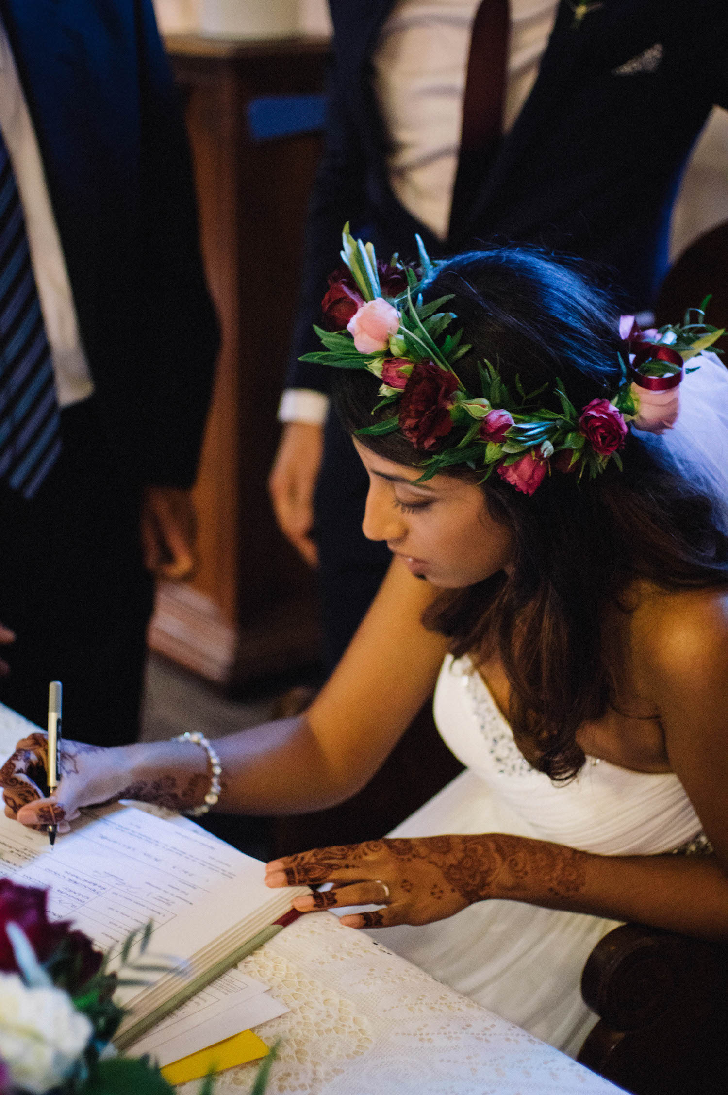 An Indian-Canadian bride signing the register at St Matthew's Anglican church in Perth, Australia.