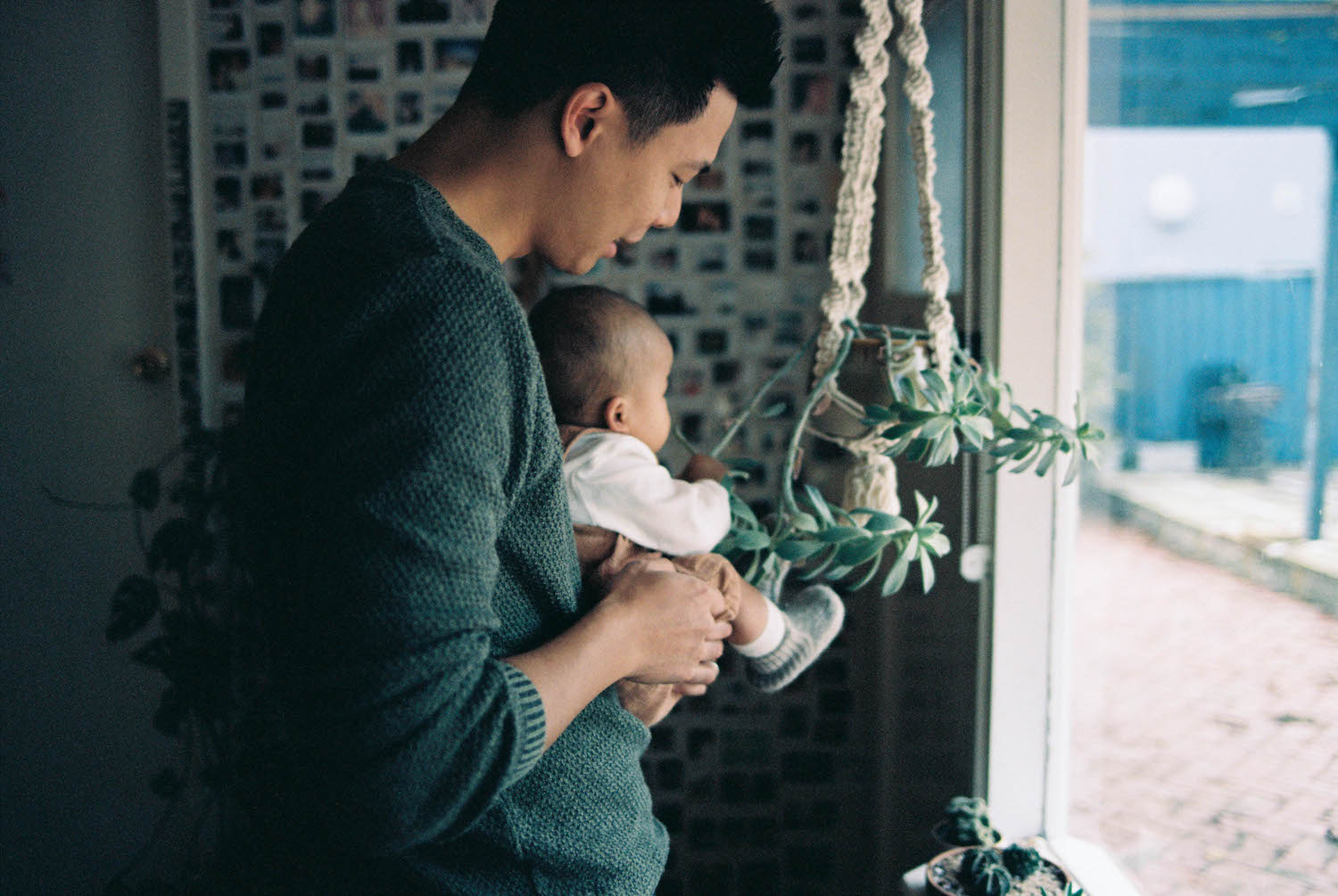 A 35mm photograph of baby Alexa & her dad Jinn at their home in Western Australia.