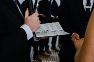 The wedding rings on the Celebrant's notebook during the ceremony.