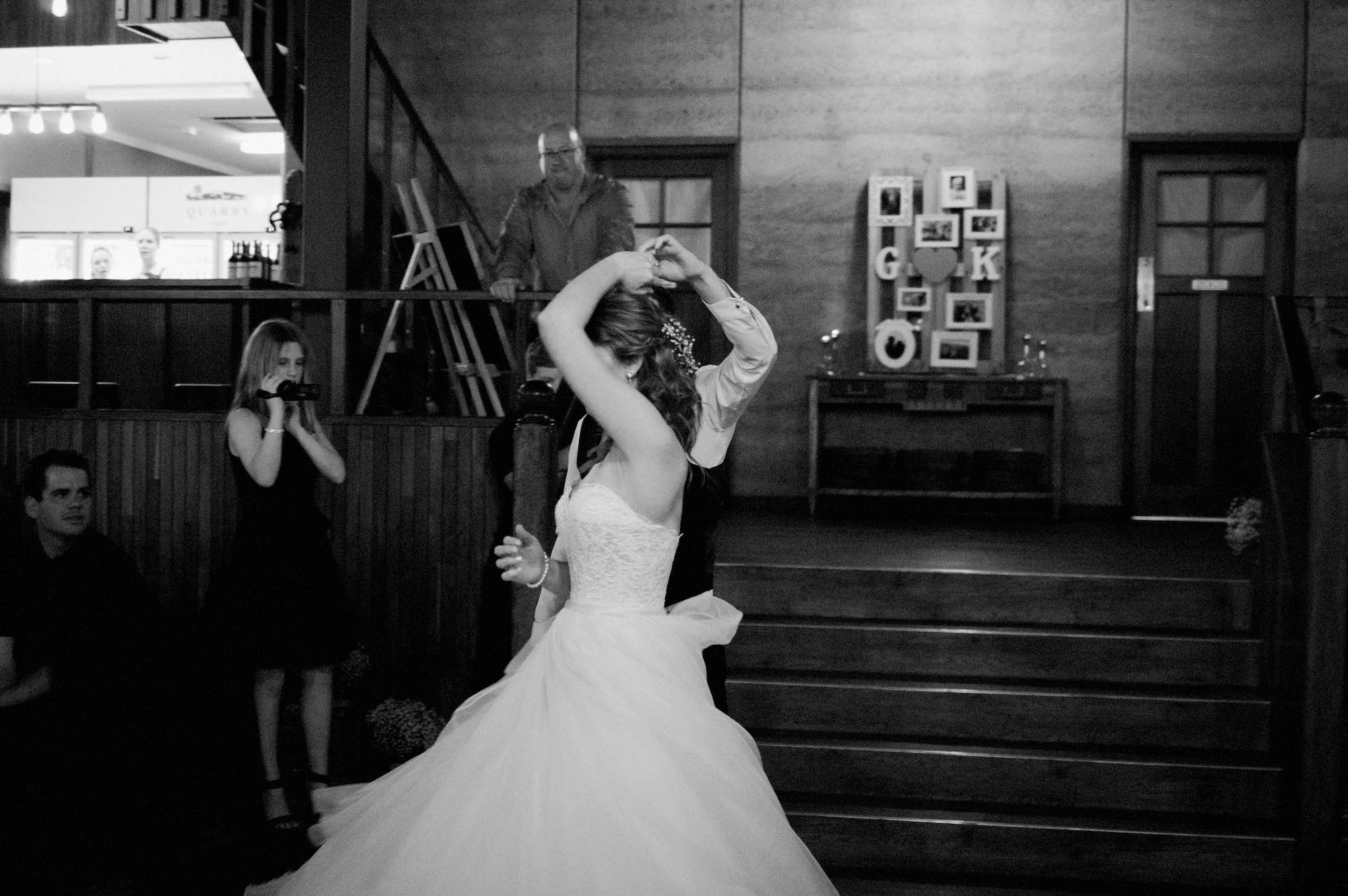 The groom spins his bride during their first dance at Quarry Farm.