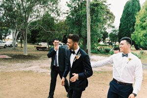 A photo of the groom and his groomsmen laughing on the way to his Down South Shearing Shed Wedding Ceremony