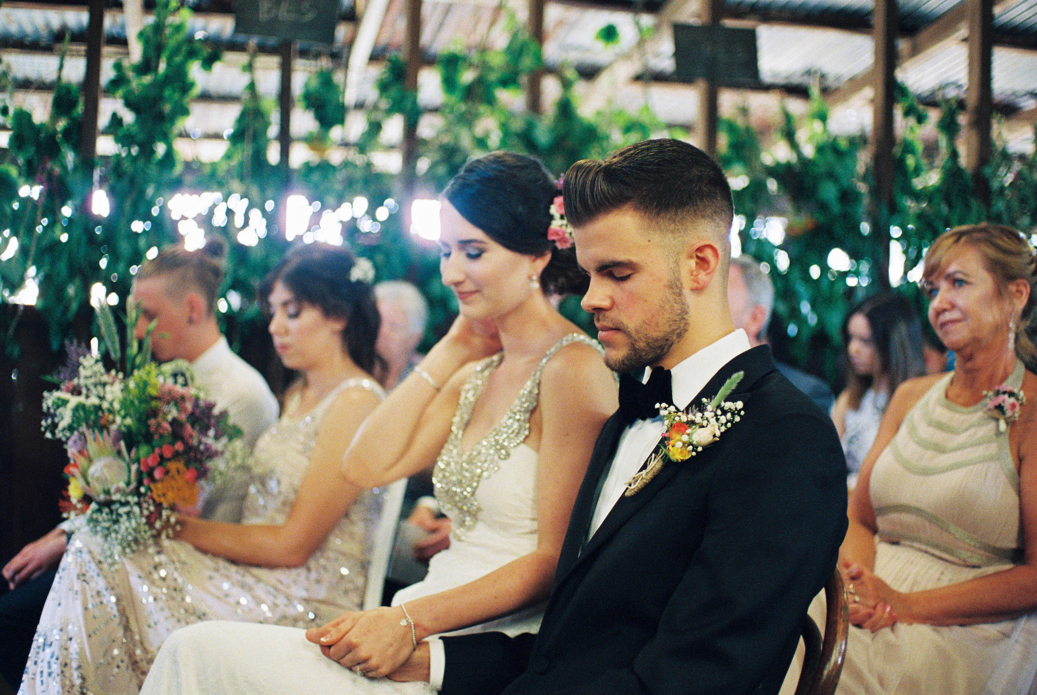 The bride & groom close their eyes during their wedding ceremony in Bridgetown, Western Australia