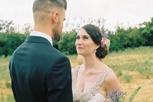 Natural Wedding Portraits of the bride and groom sharing a moment