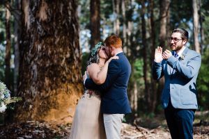 A documentary wedding photo of the bride & groom's first kiss at their Donnelly River Wedding.