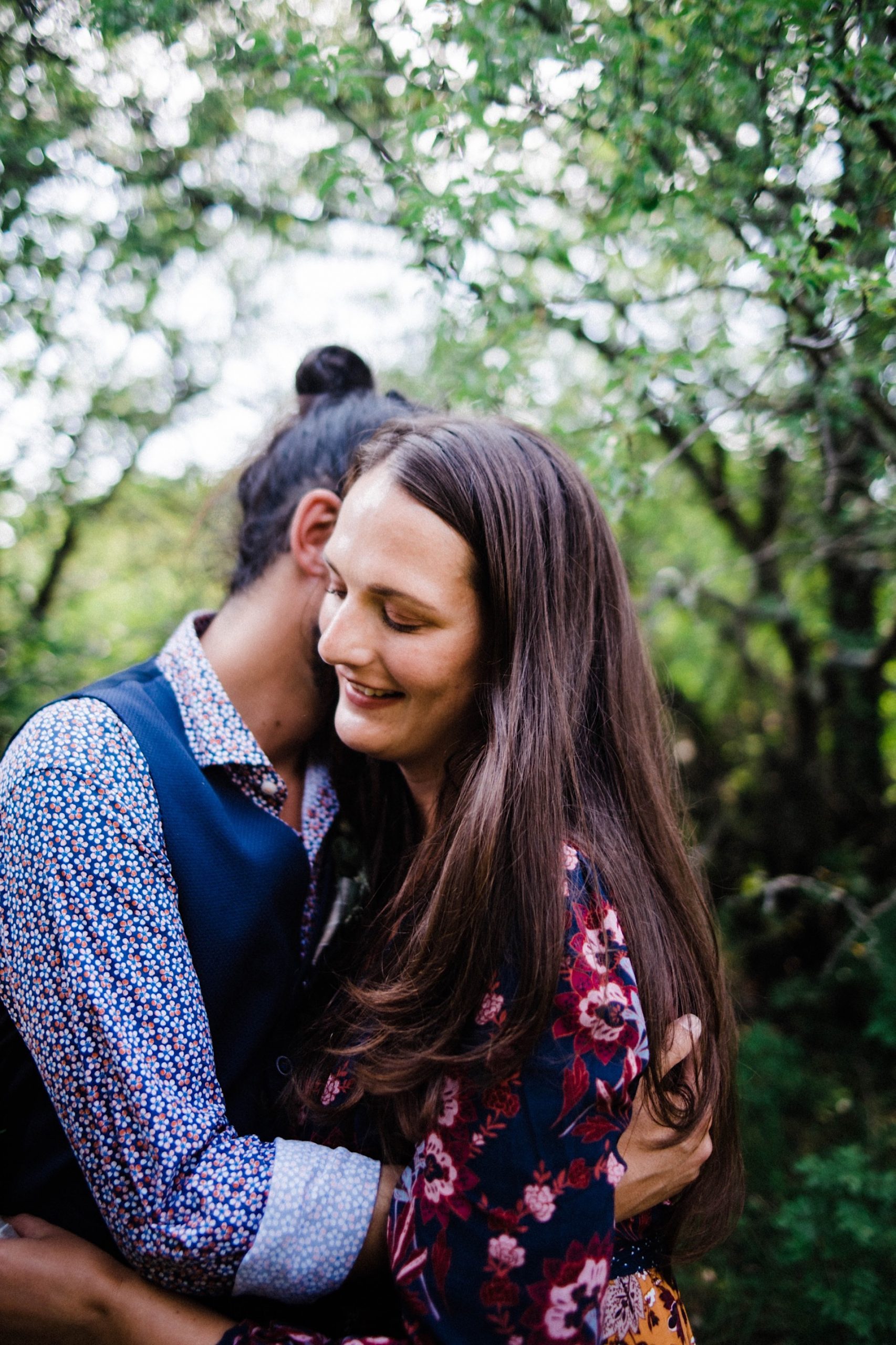 Intimate elopement photography of a newlywed couple, having wedding portraits taken in Slovenian woods after their Italian elopement.