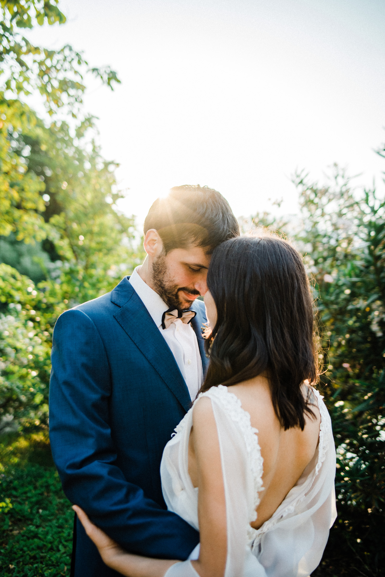 Work of an Authentic and Warm Italian Wedding Photographer, featuring a couple standing together, touching foreheads, during their Bohemian Italian Elopement